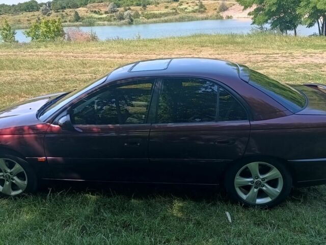 Фиолетовый Опель Омега, объемом двигателя 2.5 л и пробегом 250 тыс. км за 4200 $, фото 7 на Automoto.ua