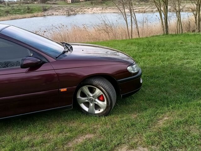 Фиолетовый Опель Омега, объемом двигателя 2.5 л и пробегом 250 тыс. км за 4200 $, фото 5 на Automoto.ua