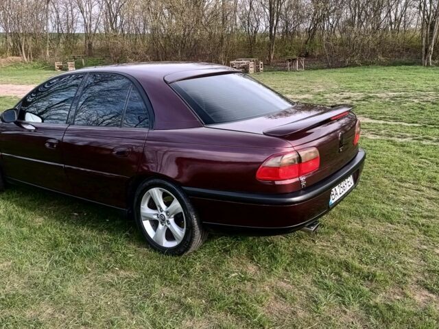 Фиолетовый Опель Омега, объемом двигателя 2.5 л и пробегом 250 тыс. км за 4200 $, фото 17 на Automoto.ua