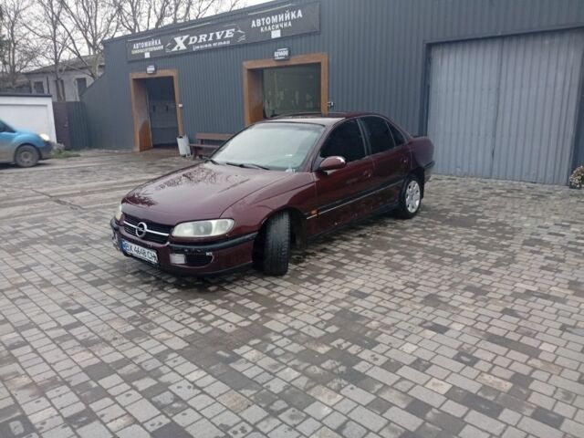 Червоний Опель Омега, об'ємом двигуна 2 л та пробігом 65 тис. км за 1550 $, фото 12 на Automoto.ua