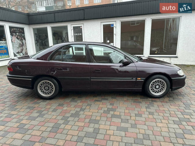 Красный Опель Омега, объемом двигателя 2 л и пробегом 301 тыс. км за 2200 $, фото 2 на Automoto.ua