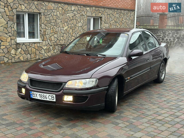 Красный Опель Омега, объемом двигателя 2 л и пробегом 301 тыс. км за 2200 $, фото 6 на Automoto.ua