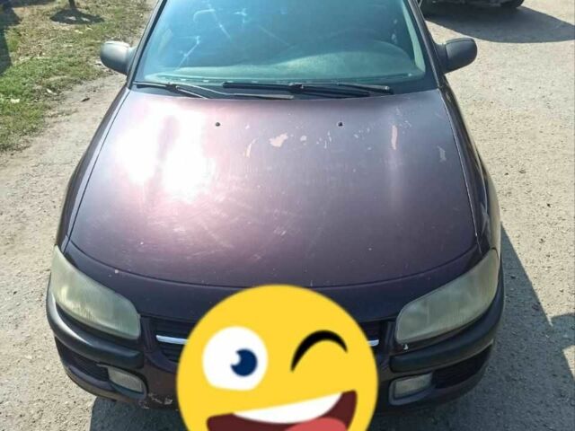 Червоний Опель Омега, об'ємом двигуна 2 л та пробігом 534 тис. км за 1200 $, фото 2 на Automoto.ua