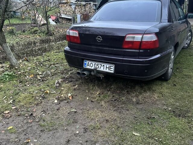 Красный Опель Омега, объемом двигателя 2 л и пробегом 330 тыс. км за 1900 $, фото 1 на Automoto.ua