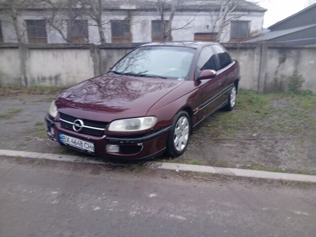 Червоний Опель Омега, об'ємом двигуна 2 л та пробігом 65 тис. км за 1550 $, фото 2 на Automoto.ua