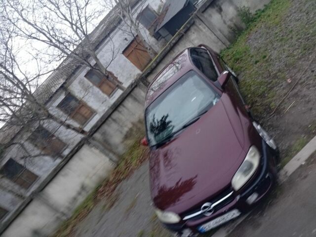 Червоний Опель Омега, об'ємом двигуна 2 л та пробігом 65 тис. км за 1550 $, фото 1 на Automoto.ua