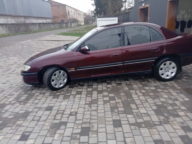 Червоний Опель Омега, об'ємом двигуна 2 л та пробігом 65 тис. км за 1550 $, фото 15 на Automoto.ua