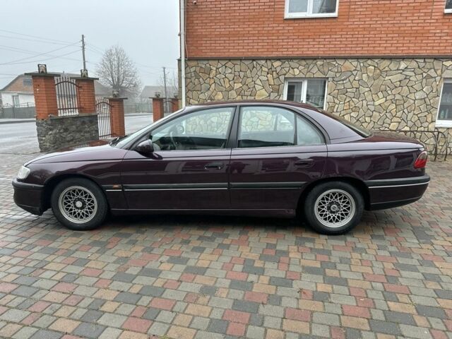 Червоний Опель Омега, об'ємом двигуна 2 л та пробігом 301 тис. км за 2200 $, фото 6 на Automoto.ua