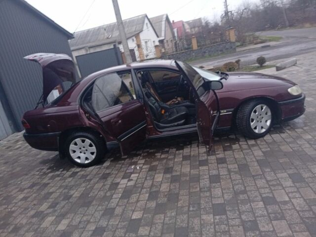 Червоний Опель Омега, об'ємом двигуна 2 л та пробігом 65 тис. км за 1550 $, фото 17 на Automoto.ua