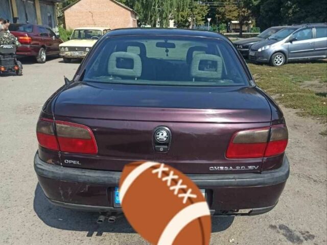 Червоний Опель Омега, об'ємом двигуна 2 л та пробігом 534 тис. км за 1200 $, фото 3 на Automoto.ua