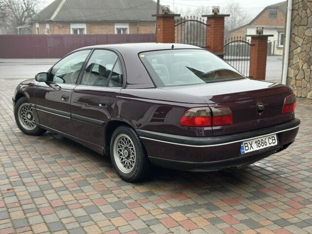 Червоний Опель Омега, об'ємом двигуна 2 л та пробігом 301 тис. км за 2200 $, фото 1 на Automoto.ua