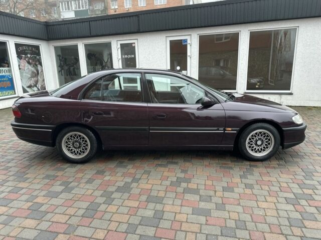 Червоний Опель Омега, об'ємом двигуна 2 л та пробігом 301 тис. км за 2200 $, фото 2 на Automoto.ua