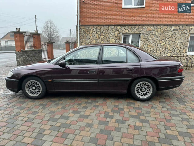 Красный Опель Омега, объемом двигателя 2 л и пробегом 301 тыс. км за 2200 $, фото 7 на Automoto.ua