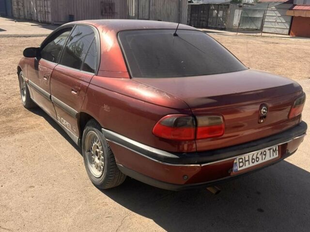 Красный Опель Омега, объемом двигателя 2.5 л и пробегом 385 тыс. км за 2300 $, фото 2 на Automoto.ua