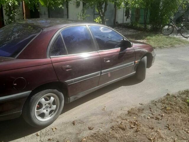 Красный Опель Омега, объемом двигателя 2 л и пробегом 140 тыс. км за 2500 $, фото 2 на Automoto.ua