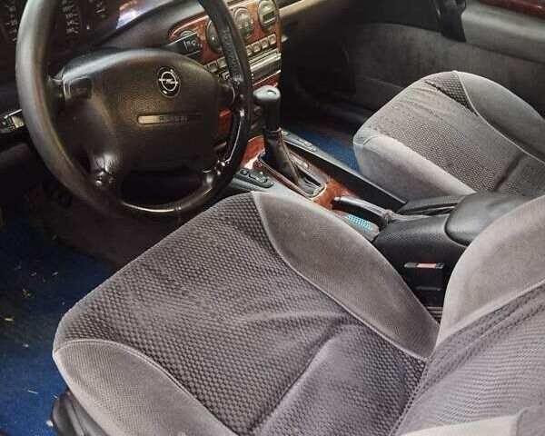 Опель Омега 1996 в Одессе на Automoto.ua Красный Опель Омега, объемом двигателя 2.5 л и пробегом 316 тыс. км за 2500 $, фото 4 на Automoto.ua