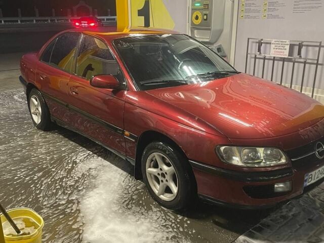 Опель Омега 1996 в Новомосковске на Automoto.ua Красный Опель Омега, объемом двигателя 2 л и пробегом 400 тыс. км за 1600 $, фото 1 на Automoto.ua