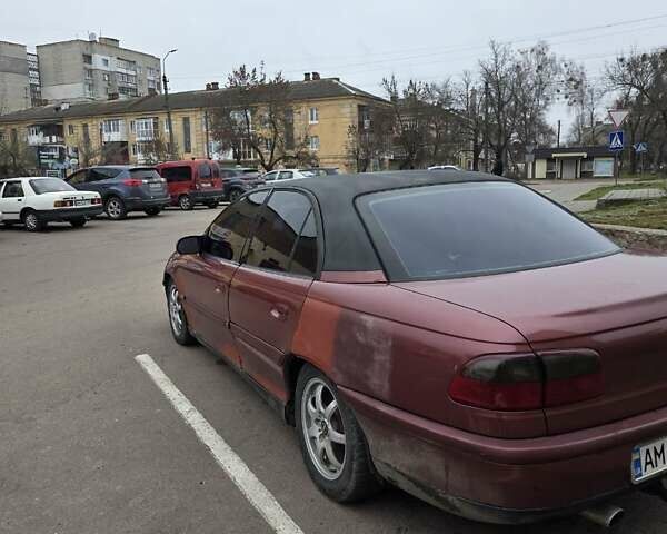 Червоний Опель Омега, об'ємом двигуна 2 л та пробігом 335 тис. км за 1750 $, фото 4 на Automoto.ua