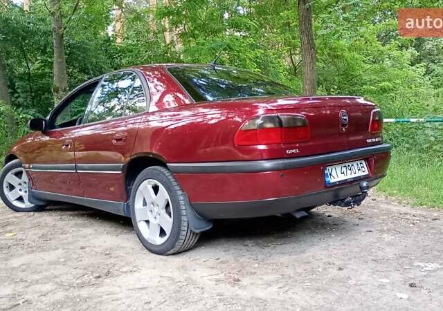 Красный Опель Омега, объемом двигателя 2.5 л и пробегом 352 тыс. км за 3300 $, фото 1 на Automoto.ua