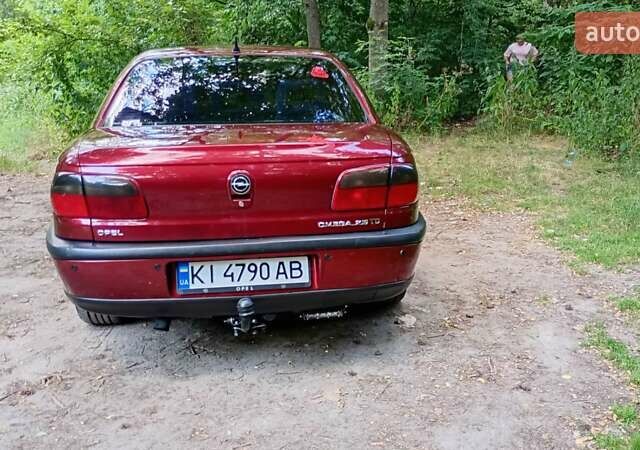 Красный Опель Омега, объемом двигателя 2.5 л и пробегом 352 тыс. км за 3300 $, фото 7 на Automoto.ua