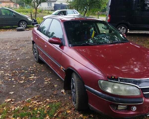 Червоний Опель Омега, об'ємом двигуна 2 л та пробігом 300 тис. км за 2200 $, фото 3 на Automoto.ua