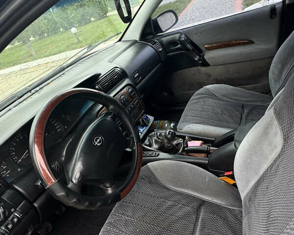 Червоний Опель Омега, об'ємом двигуна 2 л та пробігом 496 тис. км за 1800 $, фото 10 на Automoto.ua