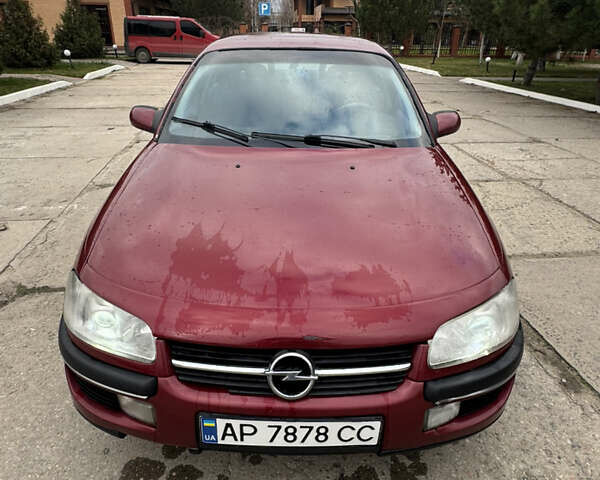 Червоний Опель Омега, об'ємом двигуна 2 л та пробігом 496 тис. км за 1800 $, фото 2 на Automoto.ua