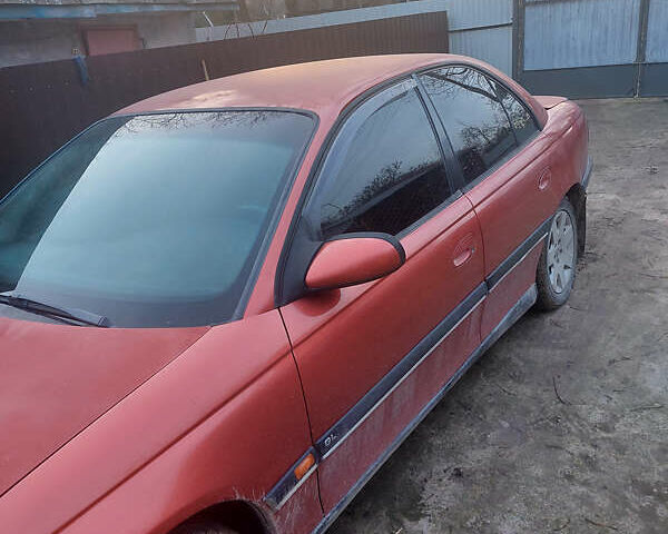 Красный Опель Омега, объемом двигателя 2 л и пробегом 240 тыс. км за 1200 $, фото 1 на Automoto.ua