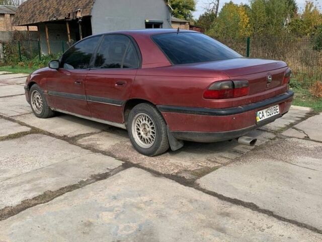 Червоний Опель Омега, об'ємом двигуна 2 л та пробігом 250 тис. км за 1500 $, фото 2 на Automoto.ua