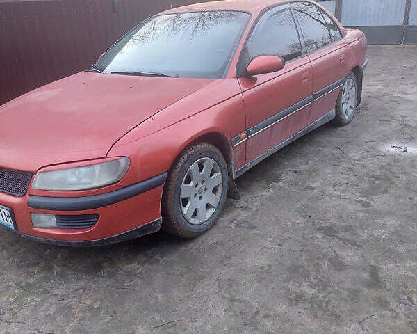 Красный Опель Омега, объемом двигателя 2 л и пробегом 240 тыс. км за 1200 $, фото 9 на Automoto.ua