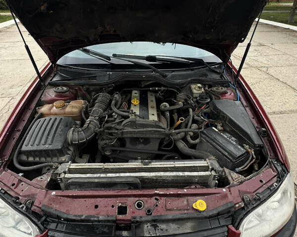 Червоний Опель Омега, об'ємом двигуна 2 л та пробігом 496 тис. км за 1800 $, фото 13 на Automoto.ua