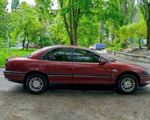 Красный Опель Омега, объемом двигателя 2 л и пробегом 100 тыс. км за 2700 $, фото 2 на Automoto.ua