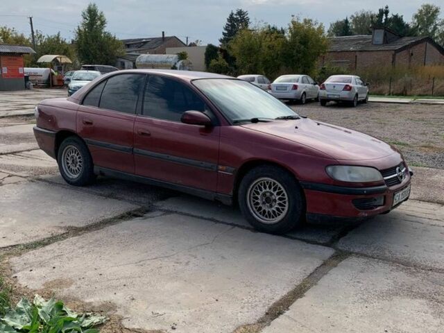 Червоний Опель Омега, об'ємом двигуна 2 л та пробігом 250 тис. км за 1500 $, фото 1 на Automoto.ua