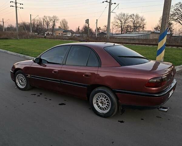 Красный Опель Омега, объемом двигателя 2 л и пробегом 400 тыс. км за 2390 $, фото 7 на Automoto.ua