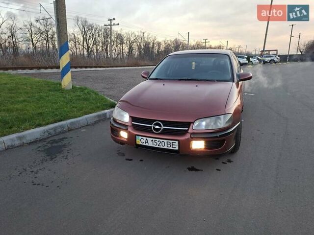 Красный Опель Омега, объемом двигателя 2 л и пробегом 400 тыс. км за 2390 $, фото 1 на Automoto.ua