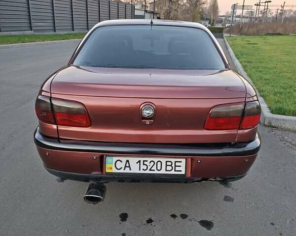 Красный Опель Омега, объемом двигателя 2 л и пробегом 400 тыс. км за 2390 $, фото 5 на Automoto.ua