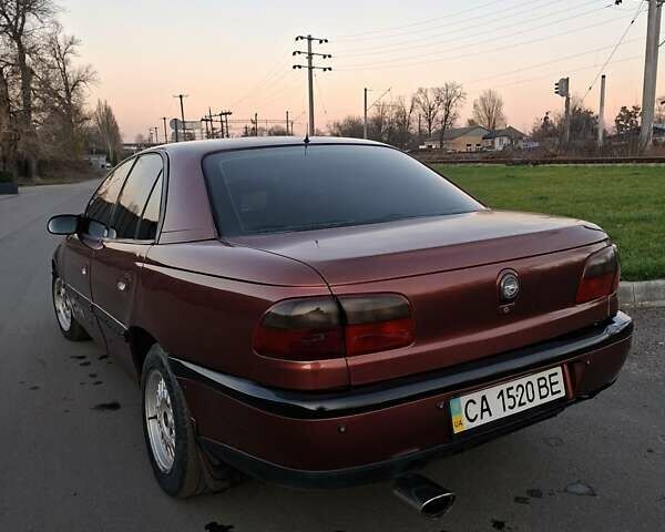 Красный Опель Омега, объемом двигателя 2 л и пробегом 400 тыс. км за 2390 $, фото 6 на Automoto.ua