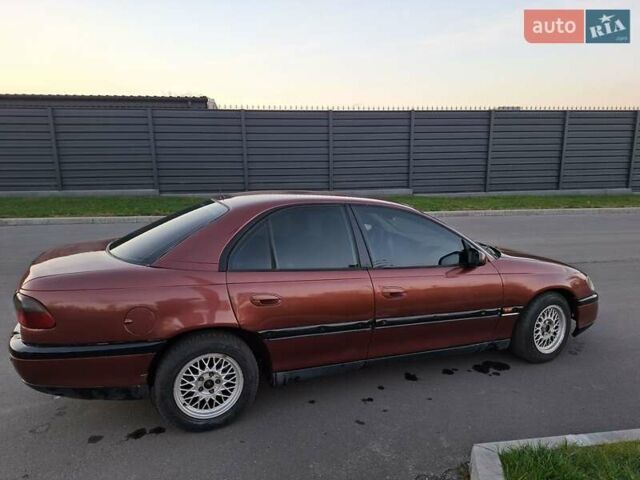 Красный Опель Омега, объемом двигателя 2 л и пробегом 400 тыс. км за 2390 $, фото 4 на Automoto.ua