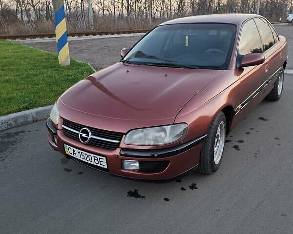 Красный Опель Омега, объемом двигателя 2 л и пробегом 400 тыс. км за 2390 $, фото 11 на Automoto.ua