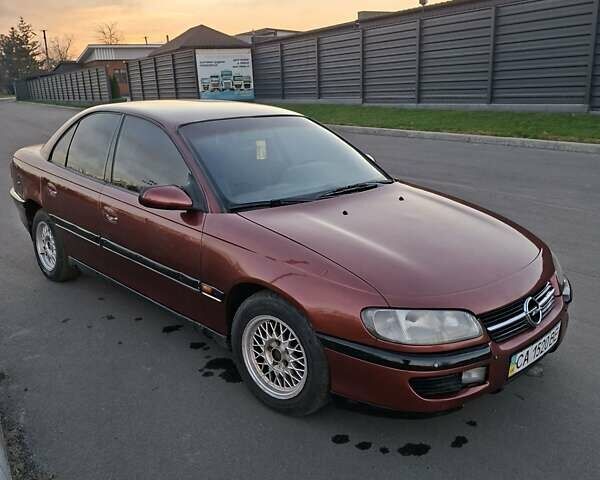 Красный Опель Омега, объемом двигателя 2 л и пробегом 400 тыс. км за 2390 $, фото 3 на Automoto.ua