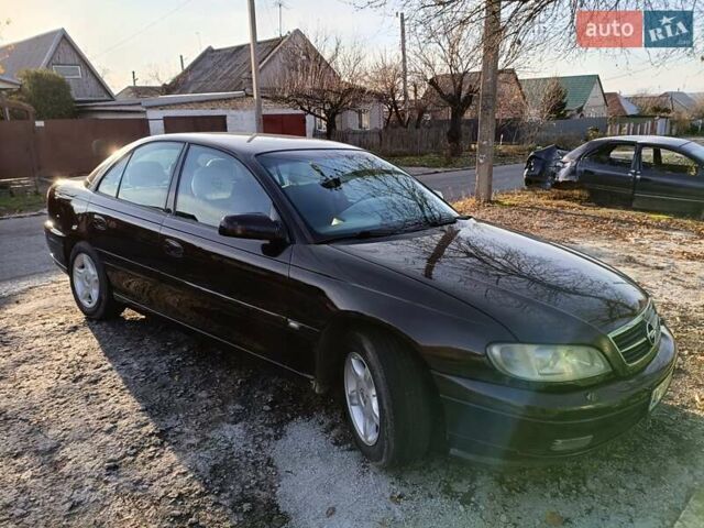 Красный Опель Омега, объемом двигателя 2.2 л и пробегом 222 тыс. км за 3500 $, фото 7 на Automoto.ua