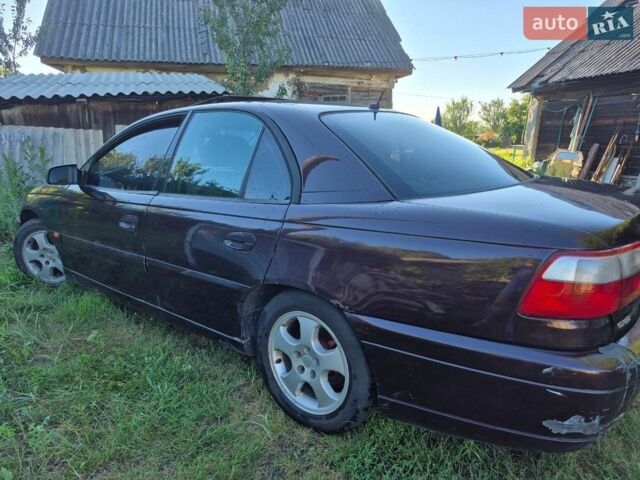 Красный Опель Омега, объемом двигателя 2.2 л и пробегом 350 тыс. км за 1600 $, фото 3 на Automoto.ua