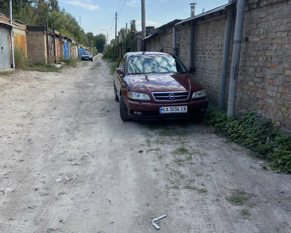 Красный Опель Омега, объемом двигателя 2.6 л и пробегом 336 тыс. км за 1800 $, фото 14 на Automoto.ua