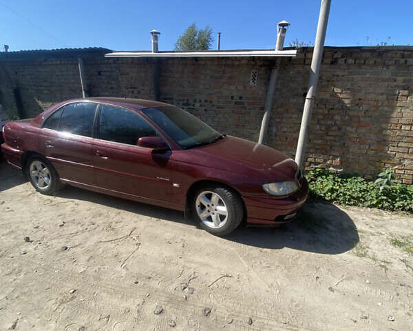 Красный Опель Омега, объемом двигателя 2.6 л и пробегом 336 тыс. км за 1800 $, фото 4 на Automoto.ua