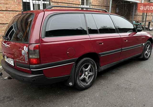 Красный Опель Омега, объемом двигателя 2 л и пробегом 321 тыс. км за 4200 $, фото 3 на Automoto.ua