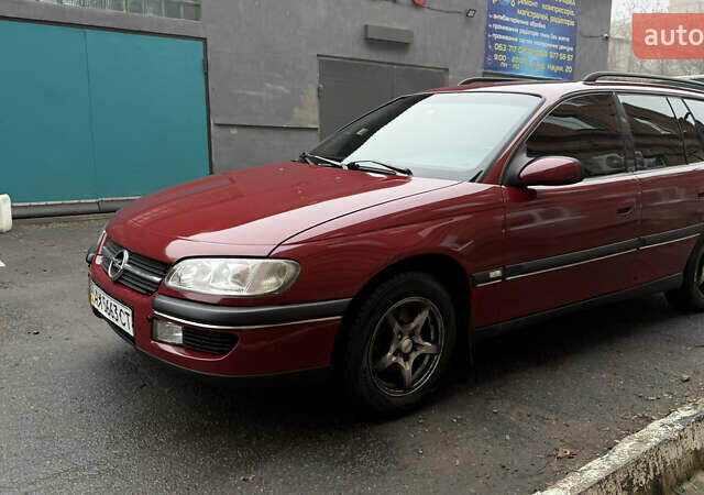 Красный Опель Омега, объемом двигателя 2 л и пробегом 321 тыс. км за 4200 $, фото 1 на Automoto.ua