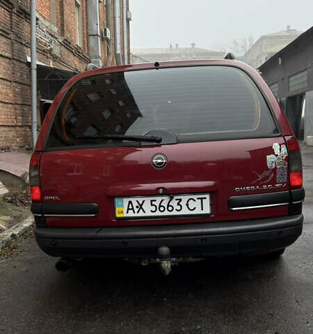 Червоний Опель Омега, об'ємом двигуна 2 л та пробігом 321 тис. км за 3000 $, фото 4 на Automoto.ua