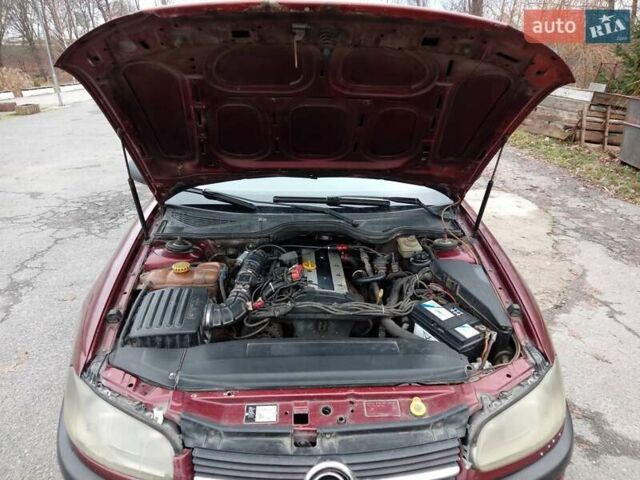 Красный Опель Омега, объемом двигателя 2 л и пробегом 317 тыс. км за 1450 $, фото 5 на Automoto.ua