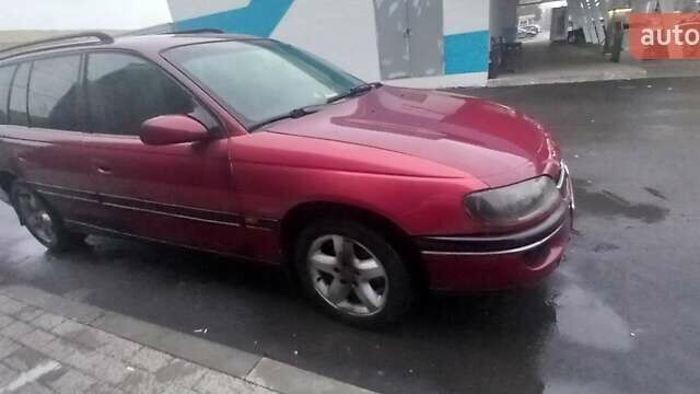 Червоний Опель Омега, об'ємом двигуна 2 л та пробігом 450 тис. км за 1500 $, фото 3 на Automoto.ua