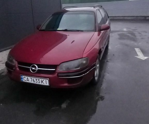 Червоний Опель Омега, об'ємом двигуна 2 л та пробігом 350 тис. км за 1500 $, фото 1 на Automoto.ua